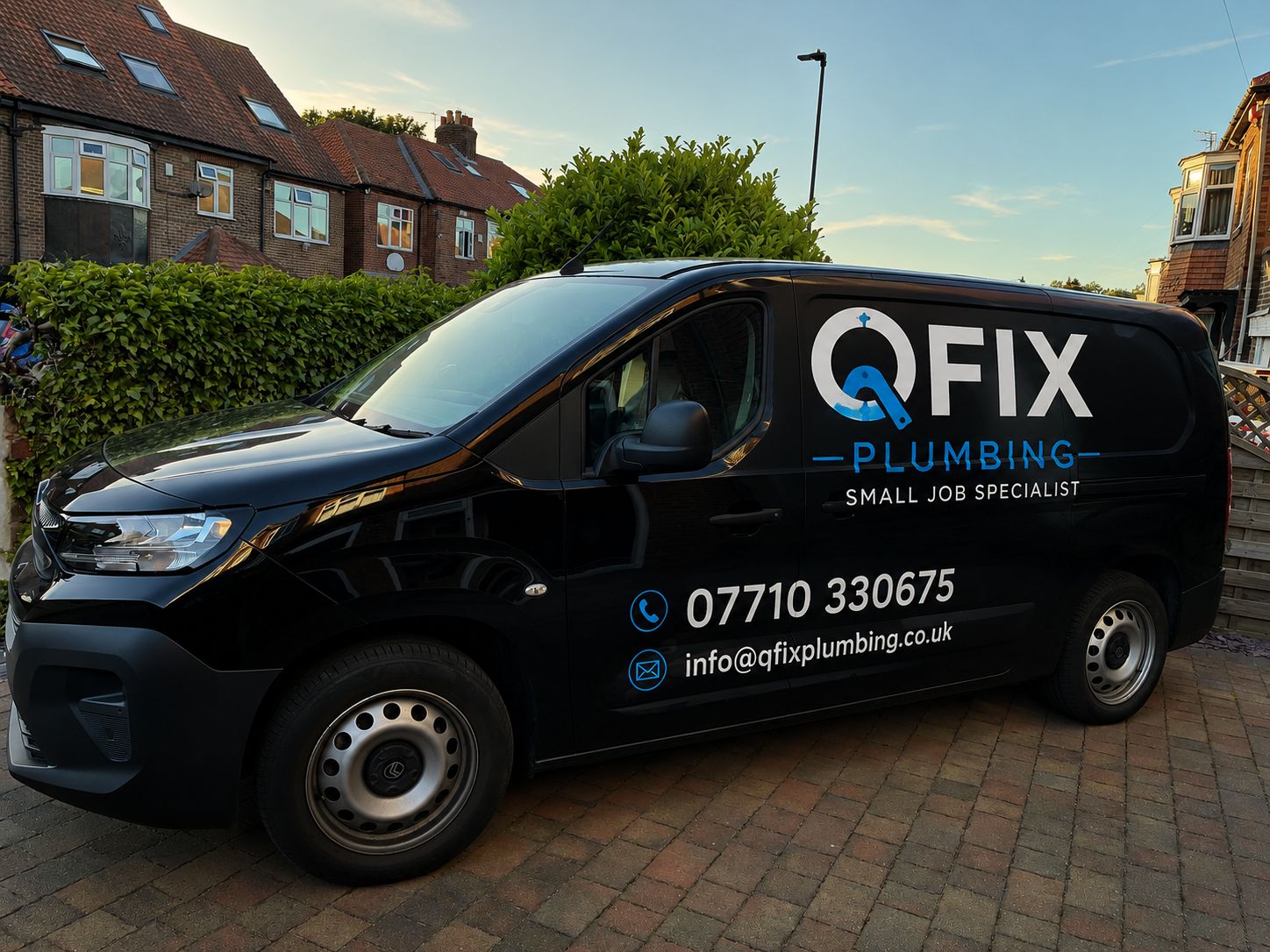 Plumber fixing under-sink pipe